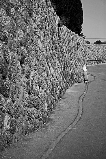 nun-walking-along-wall-bw.jpg