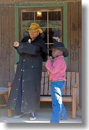 america, boys, childrens, christian, clothes, cowboy hat, fight, guns, hats, idaho, laura, mothers, north america, people, red horse mountain ranch, straw hat, united states, vertical, womens, photograph