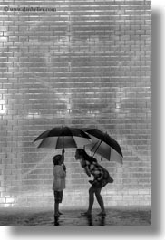 america, black and white, bricks, chicago, crown fountains, glow, illinois, jacks, jills, lights, materials, millenium park, nite, north america, rain, umbrellas, united states, vertical, weather, photograph