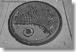 america, black and white, covers, heads, horizontal, indians, manhole covers, manholes, north america, pacific northwest, seattle, streets, united states, washington, western usa, photograph
